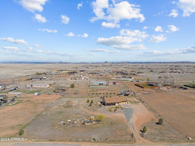 birds eye view of property with a rural view