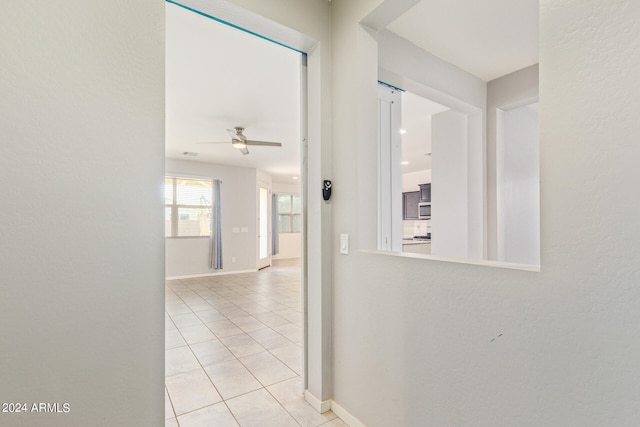 corridor with light tile patterned floors