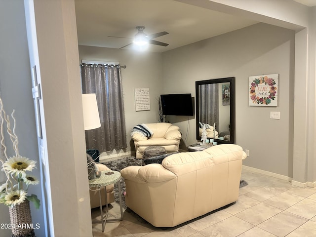 living room with ceiling fan and light tile patterned floors