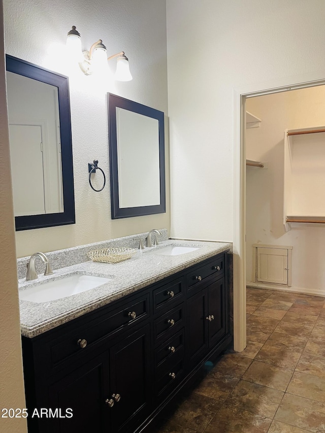 bathroom with double vanity and a sink