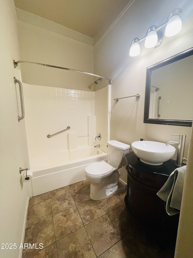 bathroom with  shower combination, baseboards, vanity, and toilet