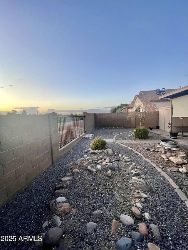 view of yard with a fenced backyard