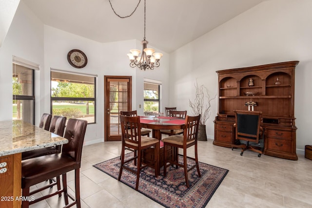 9243 W Kimberly Way, Peoria, AZ 85382 - dining area with an inviting chandelier, high vaulted ceiling, light tile patterned flooring, and a wealth of natural light