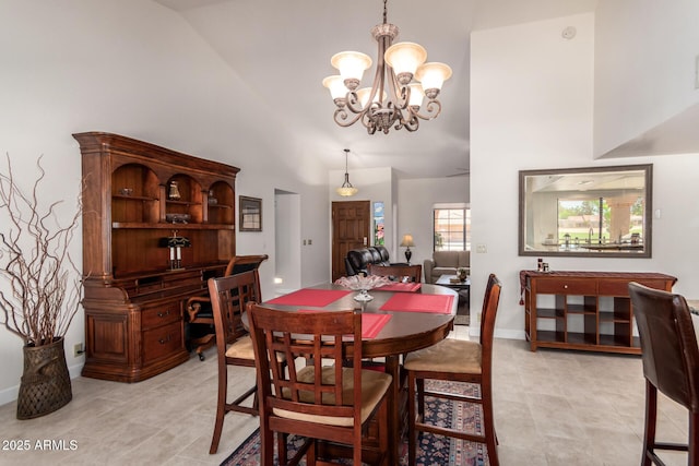 9243 W Kimberly Way, Peoria, AZ 85382 - dining room with an inviting chandelier, high vaulted ceiling, light tile patterned floors, and baseboards