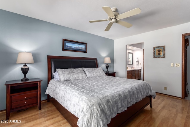 9243 W Kimberly Way, Peoria, AZ 85382 - bedroom with connected bathroom, baseboards, ceiling fan, and light wood-type flooring