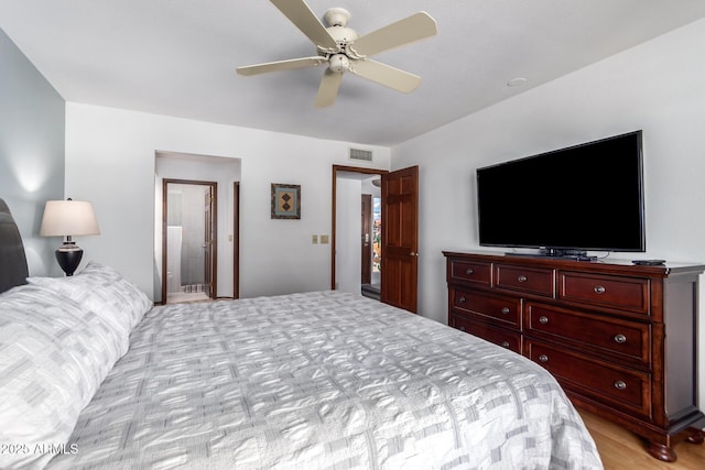 9243 W Kimberly Way, Peoria, AZ 85382 - bedroom featuring ceiling fan, visible vents, and ensuite bath