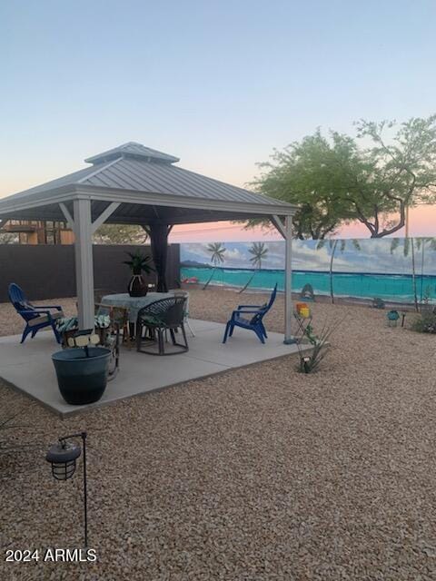 view of property's community featuring a gazebo and a patio