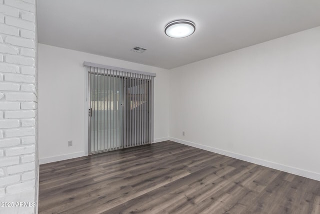 empty room featuring dark hardwood / wood-style floors