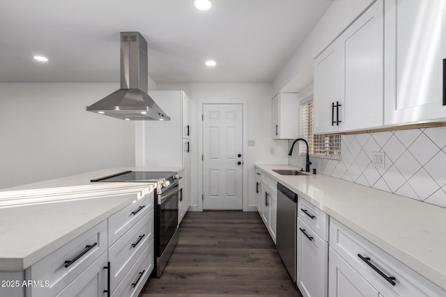 kitchen with sink, white cabinetry, stainless steel appliances, tasteful backsplash, and island range hood