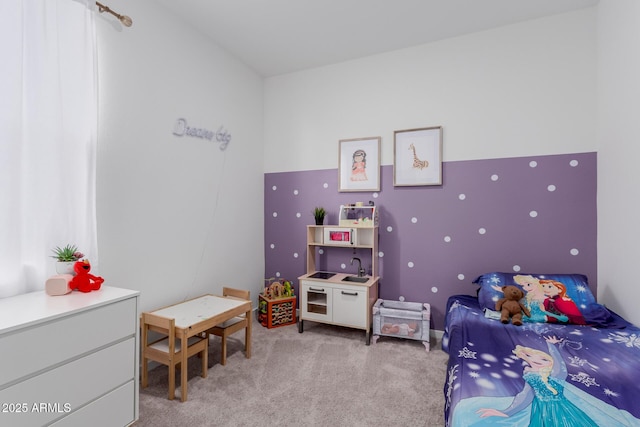 bedroom featuring light colored carpet