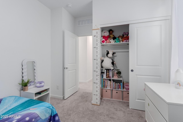 bedroom featuring light colored carpet