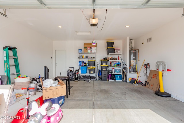 garage with a garage door opener and gas water heater