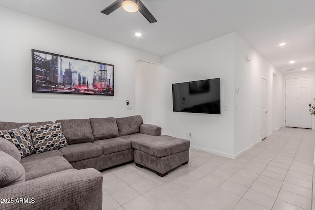 living room with light tile patterned floors and ceiling fan