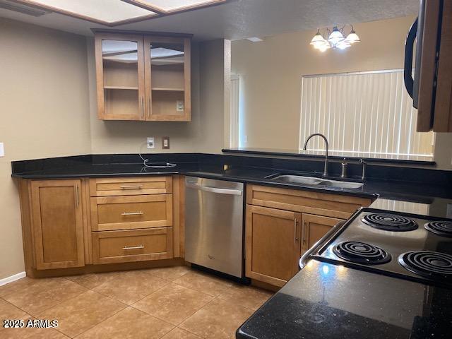 kitchen featuring electric range, glass insert cabinets, a sink, black microwave, and dishwasher