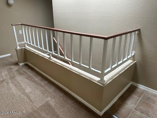 stairway with carpet flooring and baseboards