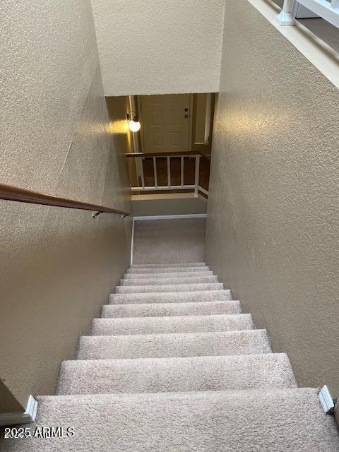 stairs with a textured wall