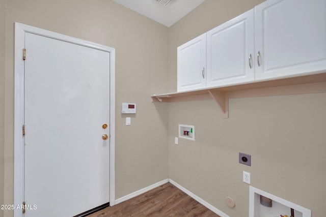 11318 W Monte Vista Rd, Avondale, AZ 85392 - laundry area with cabinet space, wood finished floors, hookup for a washing machine, electric dryer hookup, and gas dryer hookup