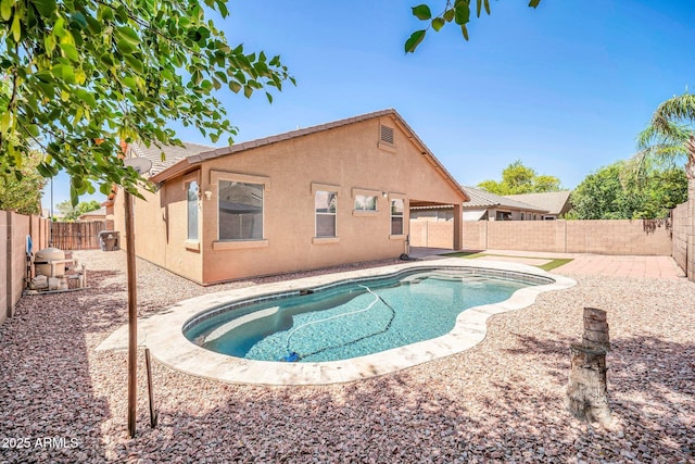 11318 W Monte Vista Rd, Avondale, AZ 85392 - view of swimming pool featuring a fenced backyard