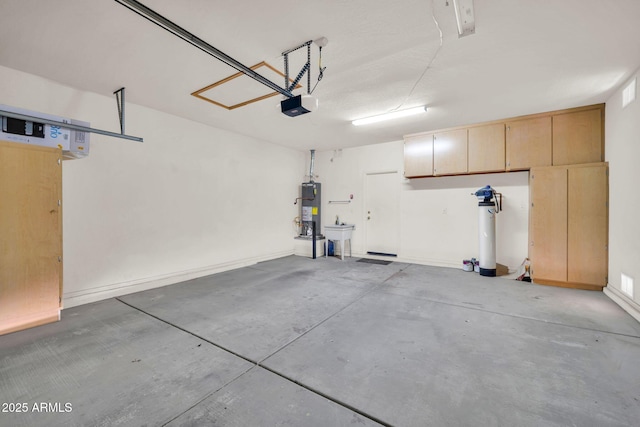 11318 W Monte Vista Rd, Avondale, AZ 85392 - garage with gas water heater and a garage door opener