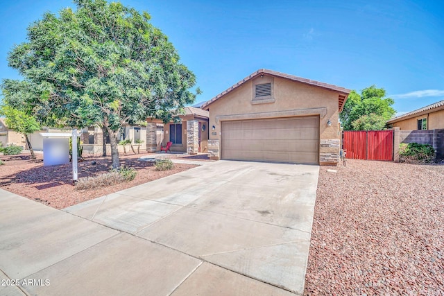 11318 W Monte Vista Rd, Avondale, AZ 85392 - single story home with stucco siding, driveway, a garage, and stone siding