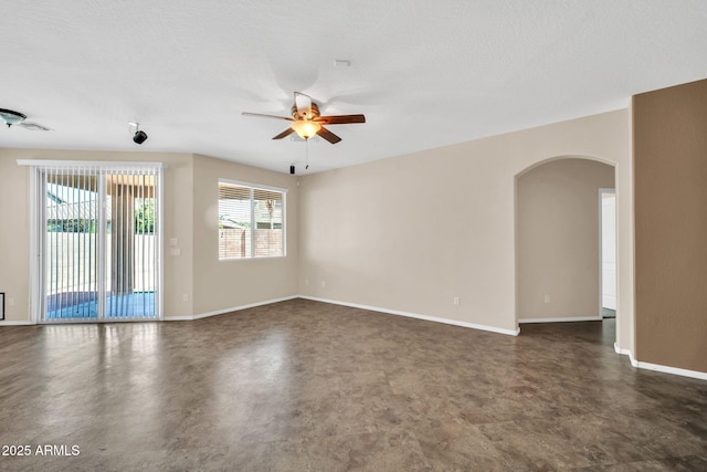 11318 W Monte Vista Rd, Avondale, AZ 85392 - unfurnished room with arched walkways and a ceiling fan