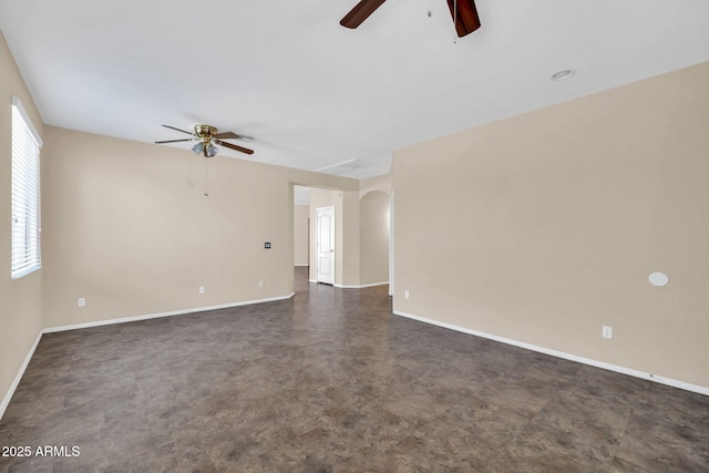 11318 W Monte Vista Rd, Avondale, AZ 85392 - spare room featuring a ceiling fan and arched walkways