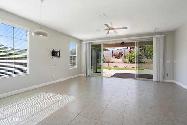 20644 W Mariposa St, Buckeye, AZ 85396 - tiled spare room with ceiling fan and baseboards
