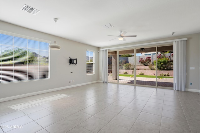 20644 W Mariposa St, Buckeye, AZ 85396 - tiled empty room featuring ceiling fan and baseboards
