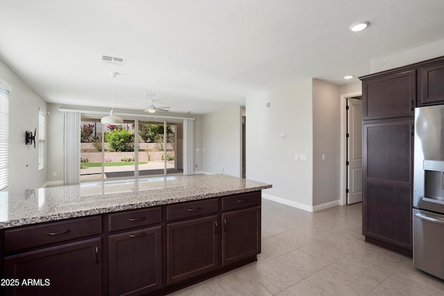 20644 W Mariposa St, Buckeye, AZ 85396 - kitchen featuring stainless steel fridge with ice dispenser, dark brown cabinets, baseboards, light tile patterned floors, and light stone counters