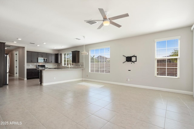 20644 W Mariposa St, Buckeye, AZ 85396 - unfurnished living room with light tile patterned floors, recessed lighting, a ceiling fan, and baseboards