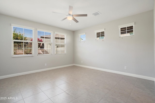 20644 W Mariposa St, Buckeye, AZ 85396 - unfurnished room featuring ceiling fan, light tile patterned floors, and baseboards