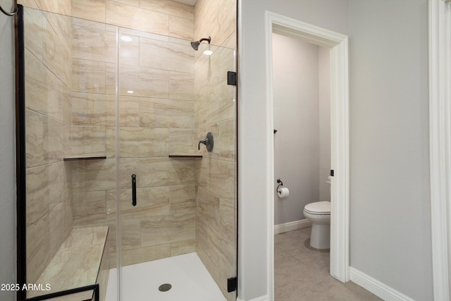 20644 W Mariposa St, Buckeye, AZ 85396 - full bathroom with a shower stall, toilet, and baseboards