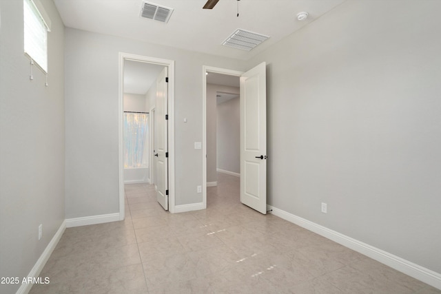 20644 W Mariposa St, Buckeye, AZ 85396 - unfurnished bedroom with baseboards and ceiling fan