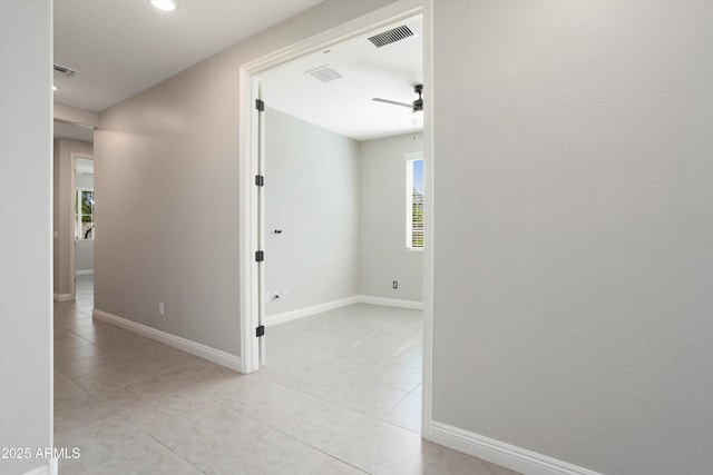 20644 W Mariposa St, Buckeye, AZ 85396 - hallway with light tile patterned floors and baseboards