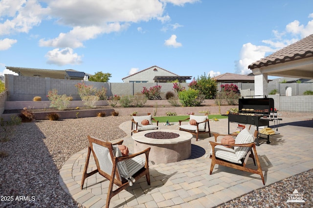 20644 W Mariposa St, Buckeye, AZ 85396 - view of patio / terrace featuring a fenced backyard and an outdoor living space with a fire pit