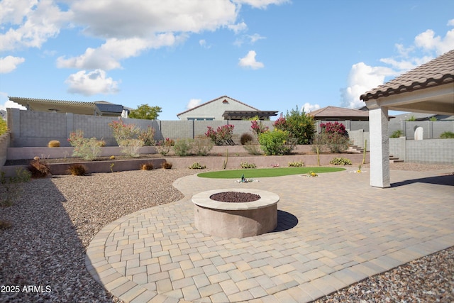 20644 W Mariposa St, Buckeye, AZ 85396 - view of patio featuring a fenced backyard and a fire pit