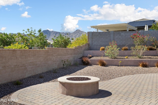20644 W Mariposa St, Buckeye, AZ 85396 - view of patio with a mountain view, an outdoor fire pit, fence, and a pergola