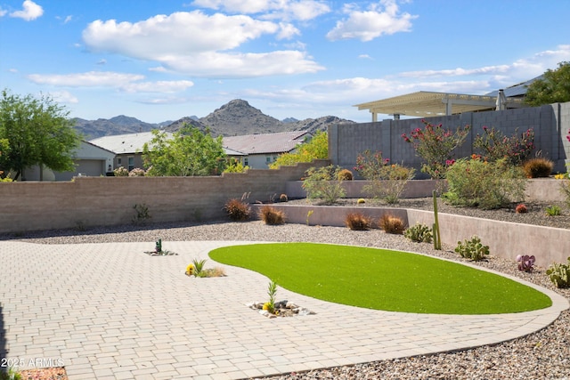 20644 W Mariposa St, Buckeye, AZ 85396 - fenced backyard with a mountain view and a patio area