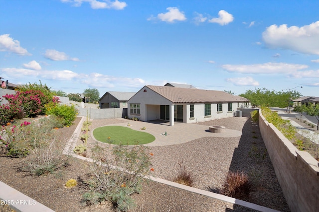 20644 W Mariposa St, Buckeye, AZ 85396 - back of property featuring a patio area, a tile roof, a fenced backyard, stucco siding, and central AC unit