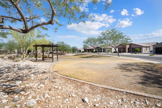 20644 W Mariposa St, Buckeye, AZ 85396 - view of yard with a residential view and a pergola