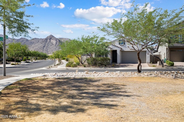 20644 W Mariposa St, Buckeye, AZ 85396 - view of asphalt road with sidewalks and a mountain view