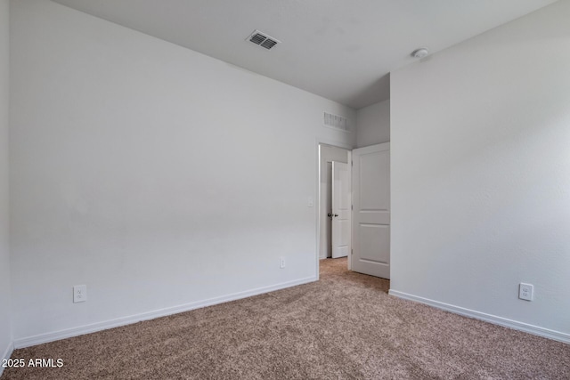 unfurnished room featuring carpet flooring