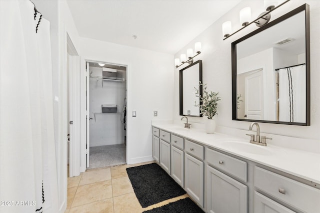 10252 E Butherus Dr, Scottsdale, AZ 85255 - full bathroom featuring double vanity, a spacious closet, and tile patterned floors
