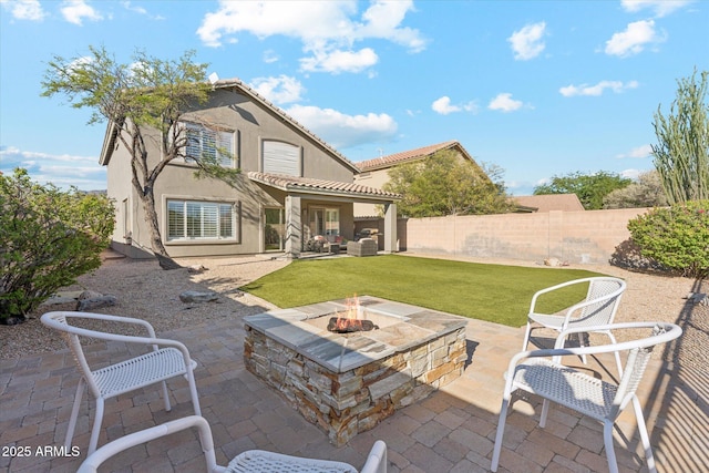 10252 E Butherus Dr, Scottsdale, AZ 85255 - back of property featuring an outdoor fire pit, stucco siding, a fenced backyard, and a patio area