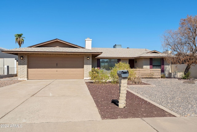 single story home featuring a garage