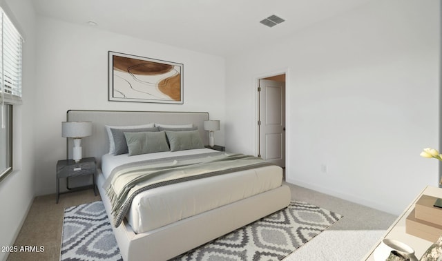 carpeted bedroom featuring visible vents and baseboards