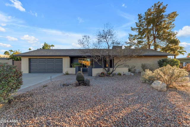 single story home with a garage