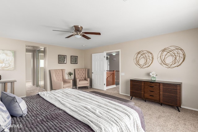 bedroom featuring ceiling fan and light carpet