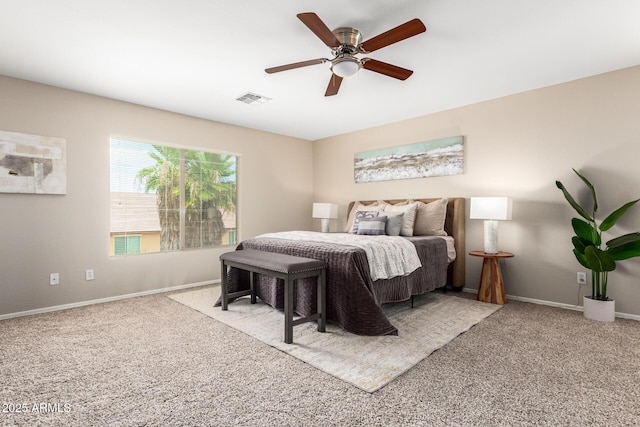 bedroom with ceiling fan and light carpet