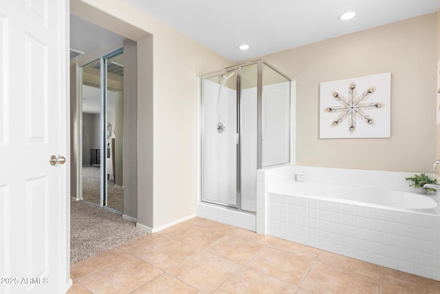 bathroom featuring separate shower and tub and tile patterned floors